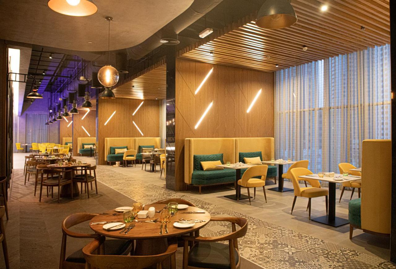 Pullman Sharjah Hotel Exterior foto The interior of the restaurant
